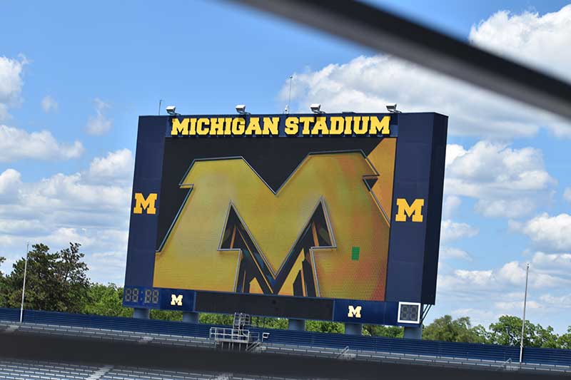 m alphabet on the stadium banner