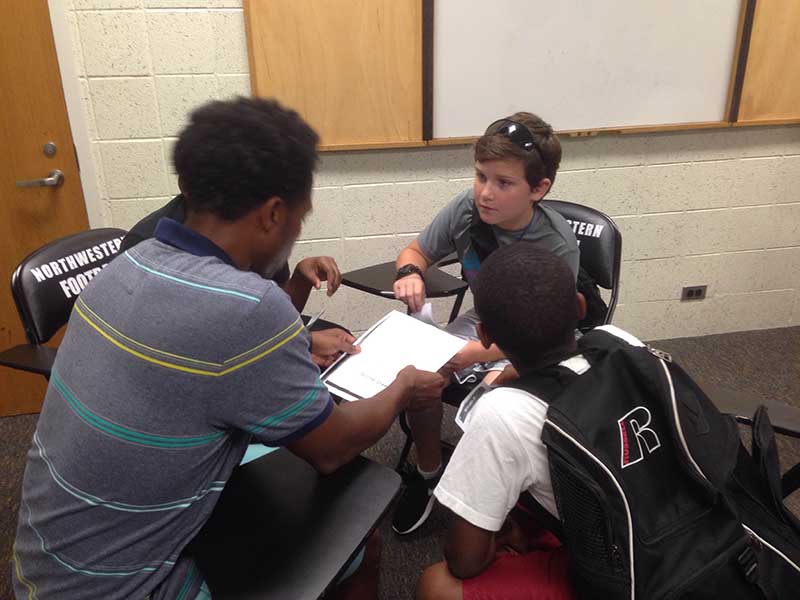 Teacher teaching student in the class room