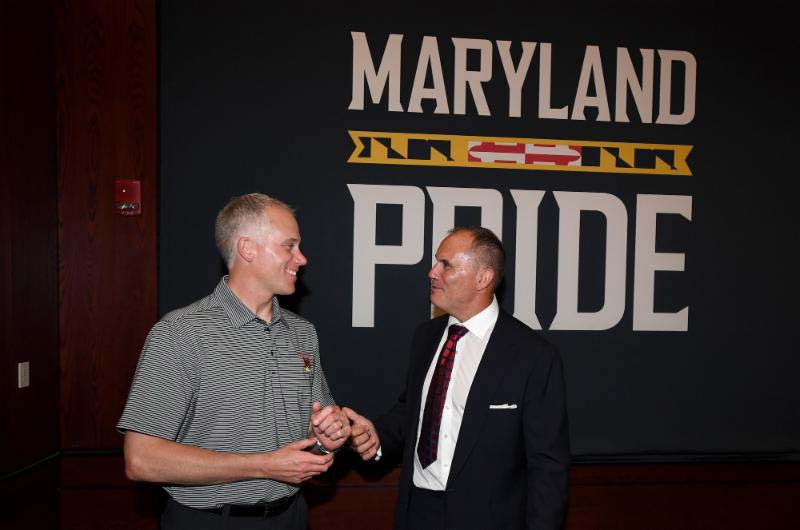 2 men talking in the Maryland Youth Impact Program