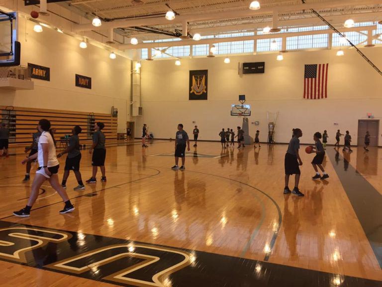 Players practicing the basketball in the court