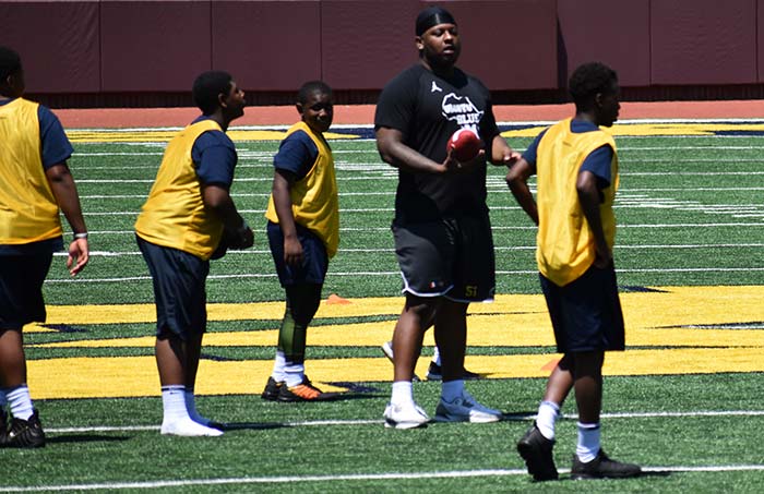 Coach teaching players