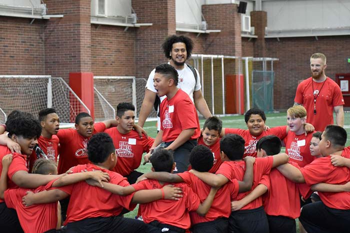 Younger students playing football