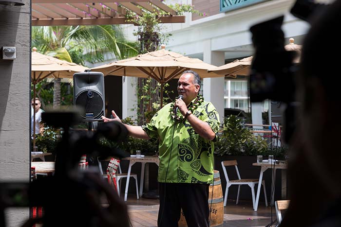 Man talking on a mike in the event