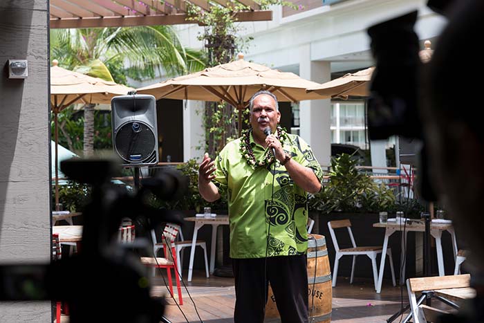 Man talking on a mike in the event