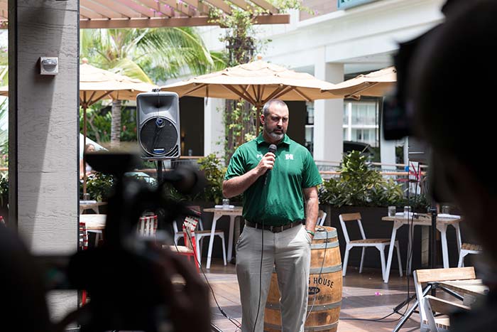 Man talking on a mike in the event