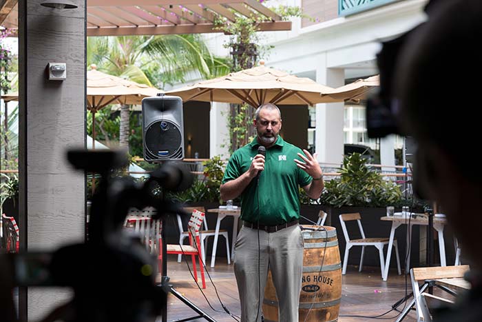 Man talking on a mike in the event