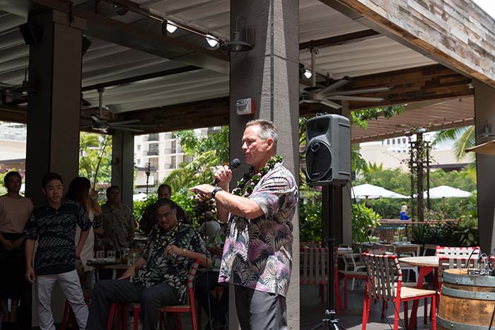 Man talking on a mike in the event