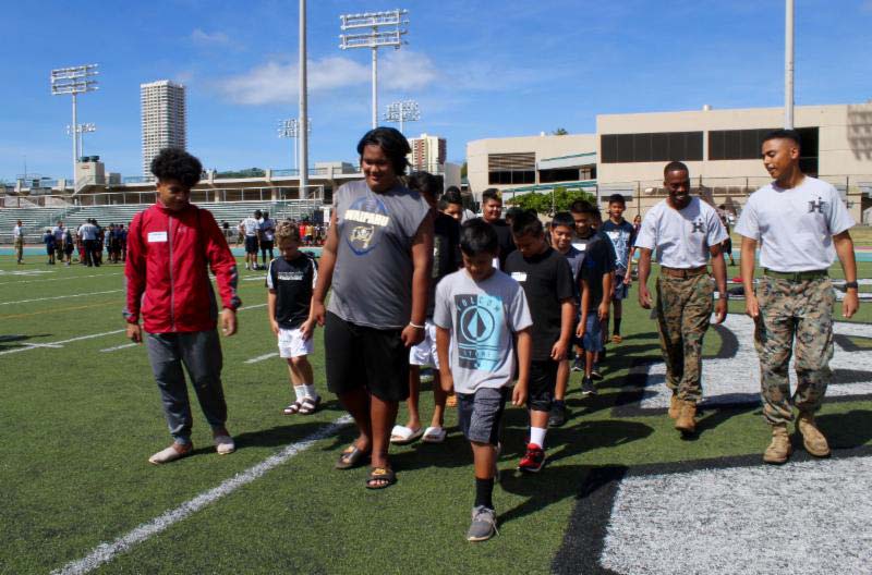 Coach takingh students to the playground