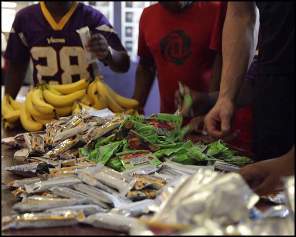 Adult examining food packets