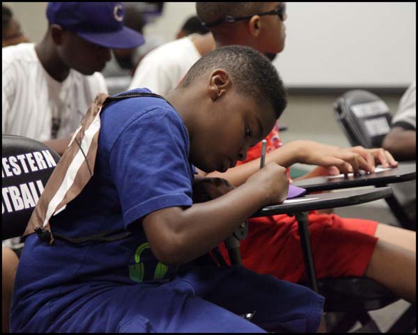 Student taking notes in class