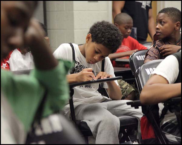 Student taking notes in class