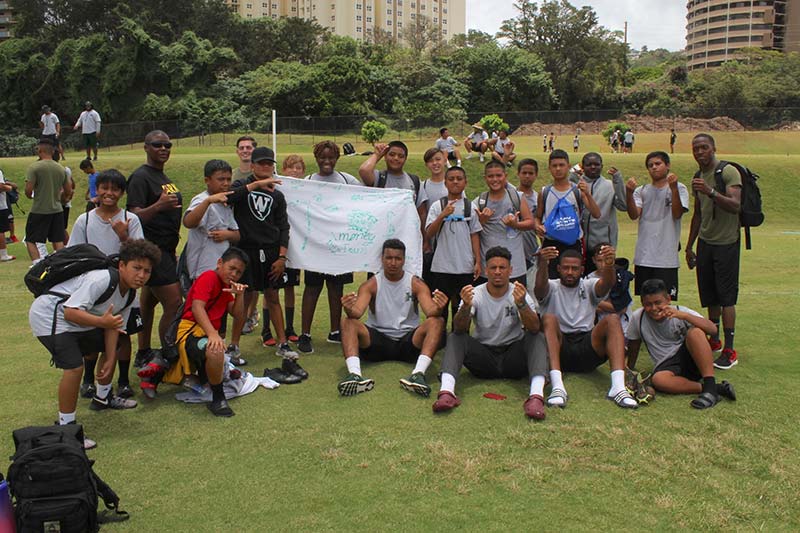 Boys along with their instructors posing for the photograph