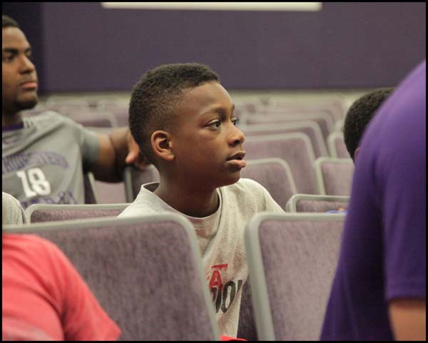 Student listening to coach in class