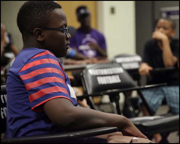 Student listening to coach in class