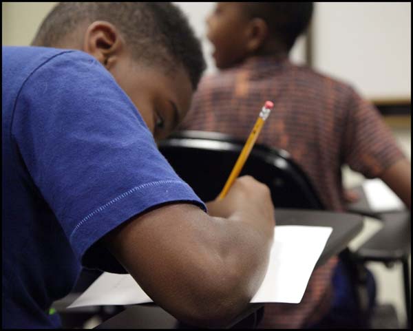 Student taking notes in class