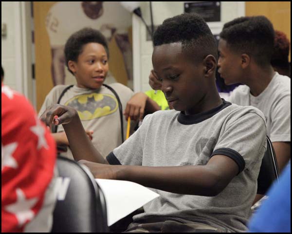 Student looking at notes in class