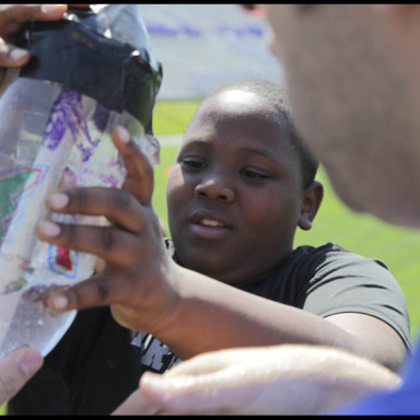 children helping with experiment