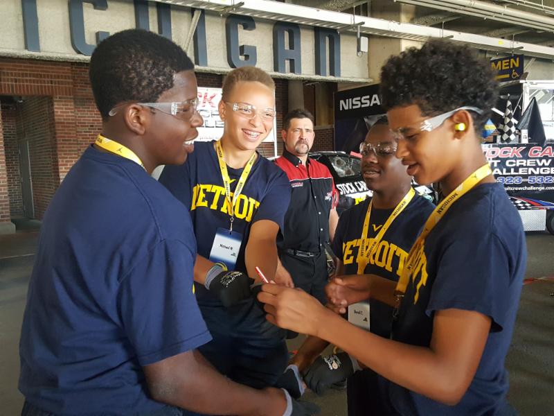 Group of Students in dark blue uniform playing