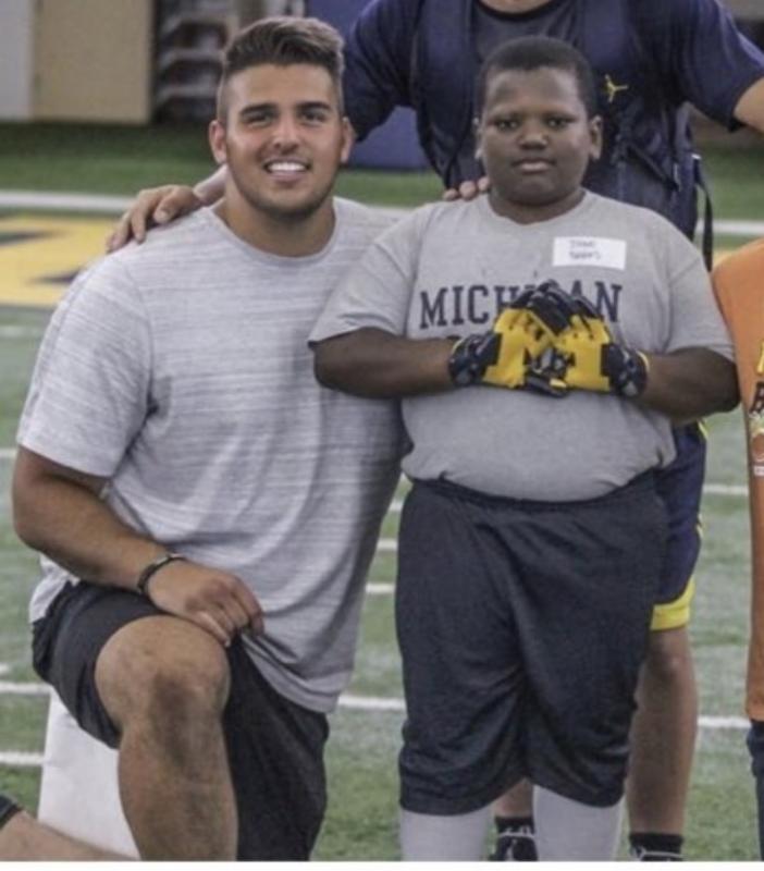 Player with his son in the stadium