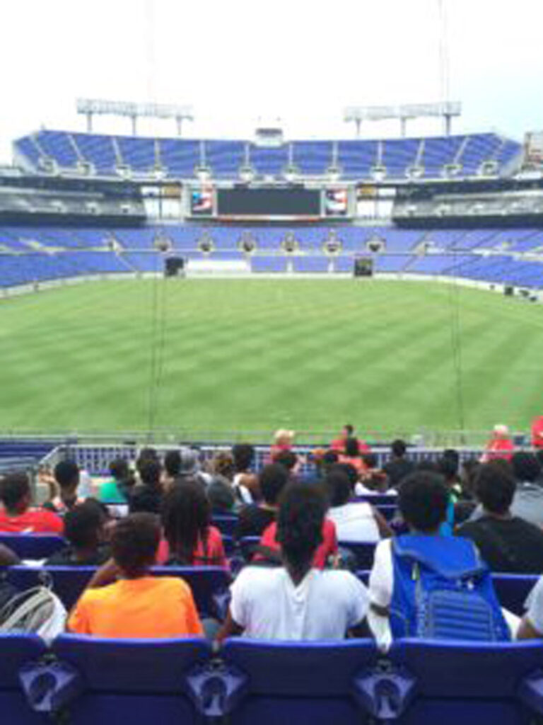 Students and Adults watching the game