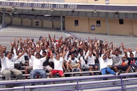 In stadium people are sitting