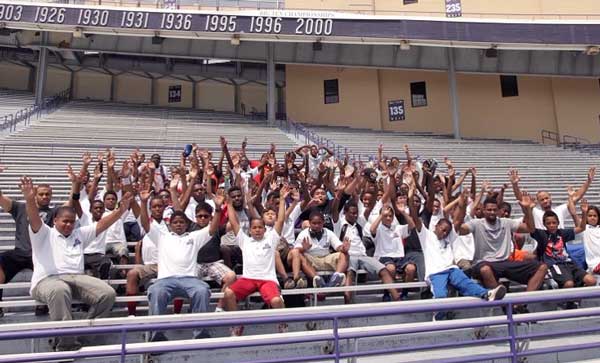 In stadium people are sitting