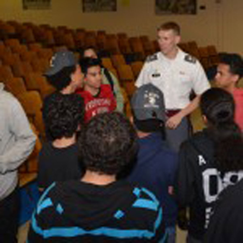 Students interacting with security officer