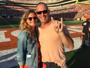 Couple posing for the photo in the stadium