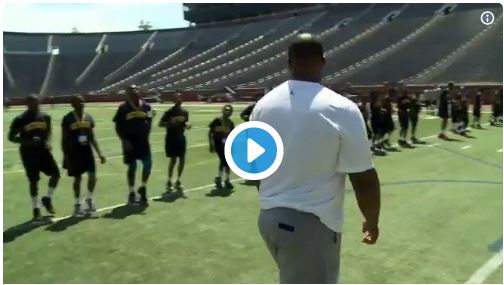 Coach training the students in the ground