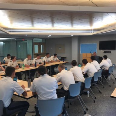 Naval candidates sitting in the meeting room