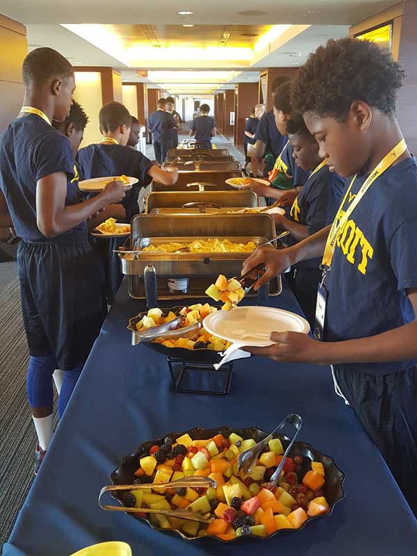 Students taking food at the food counter