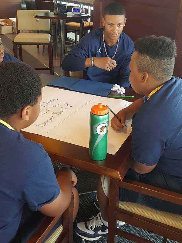 Students writing on a paper