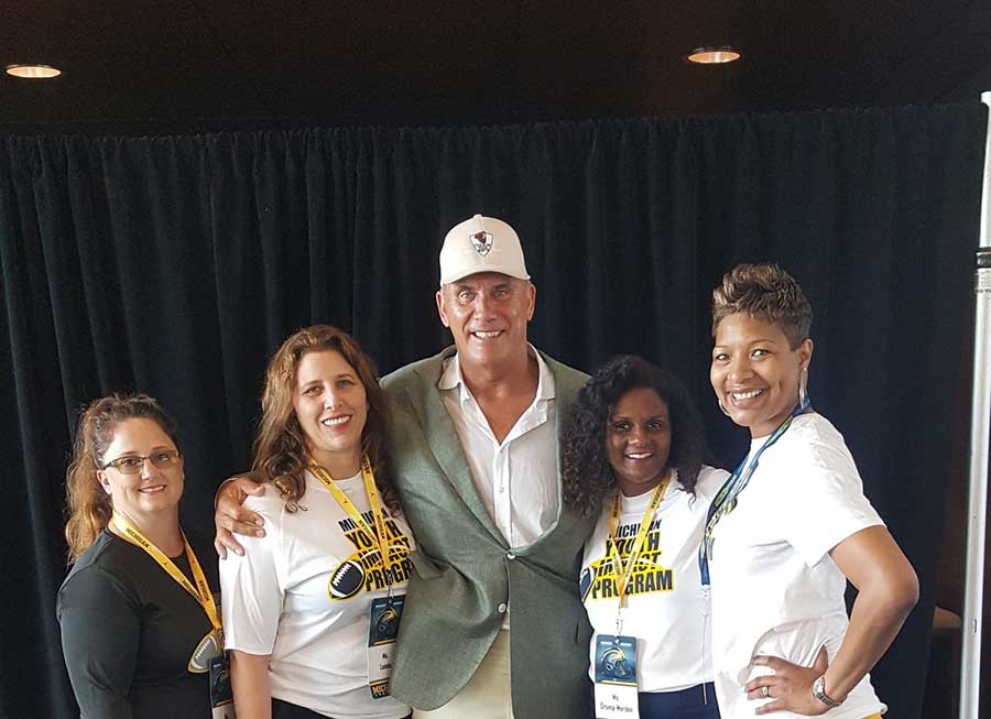 Man standing with 4 ladies