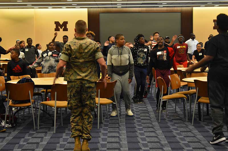 Army man instructing students