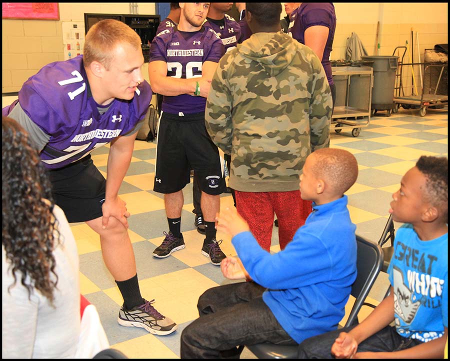 Coach talking with student