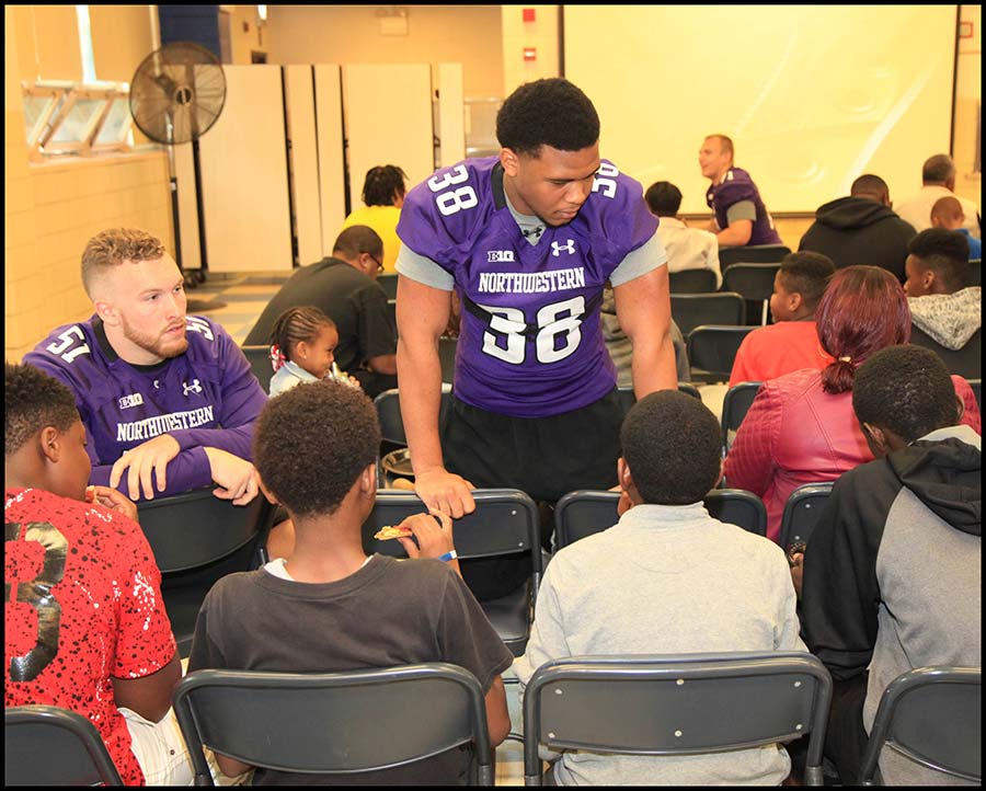 Coach talking with student