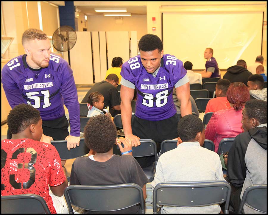 Coach talking with student