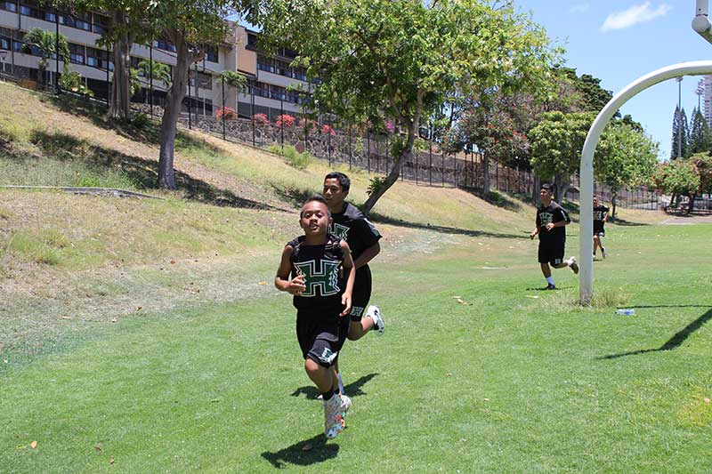 Boys running on the ground