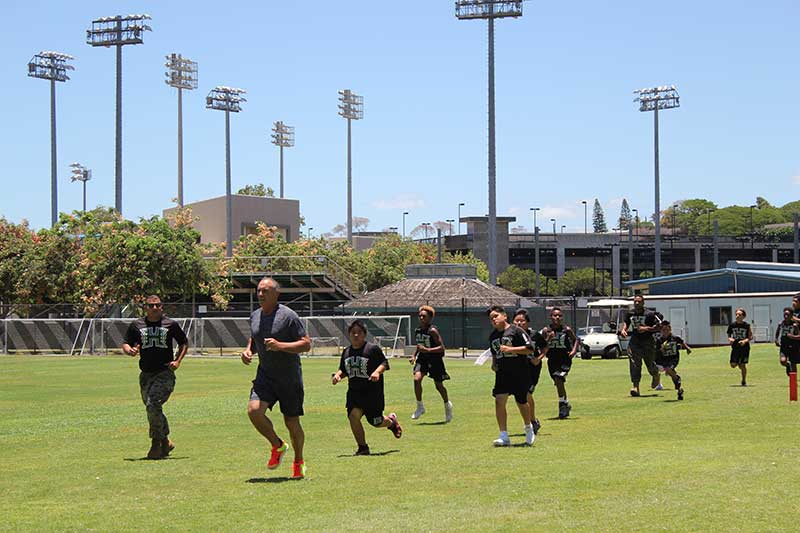 Boys running on the ground