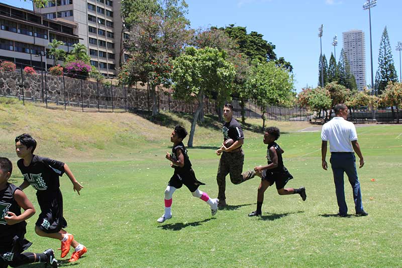 Boys running on the ground