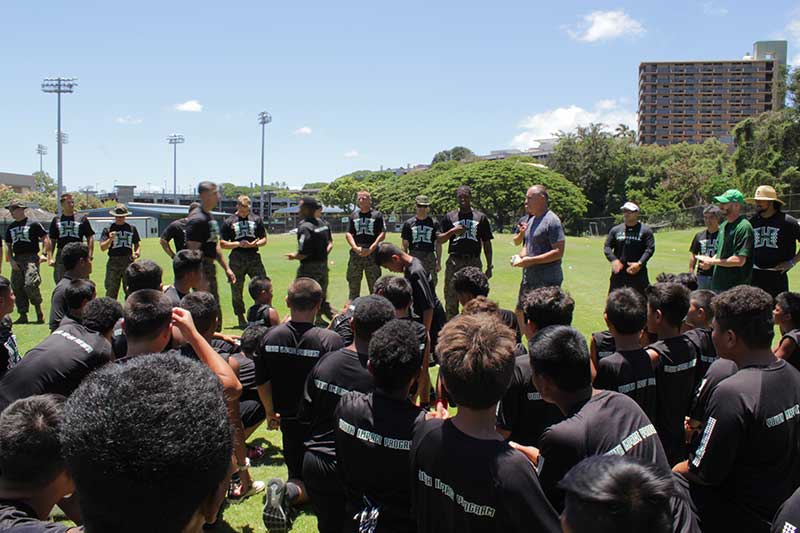 Players and their instructors on the ground