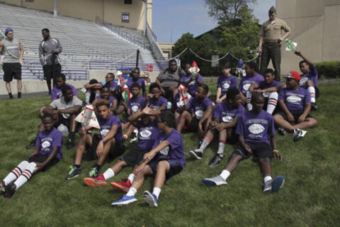 Players sitting on ground