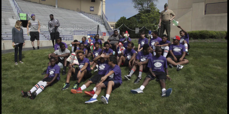 Players sitting on ground