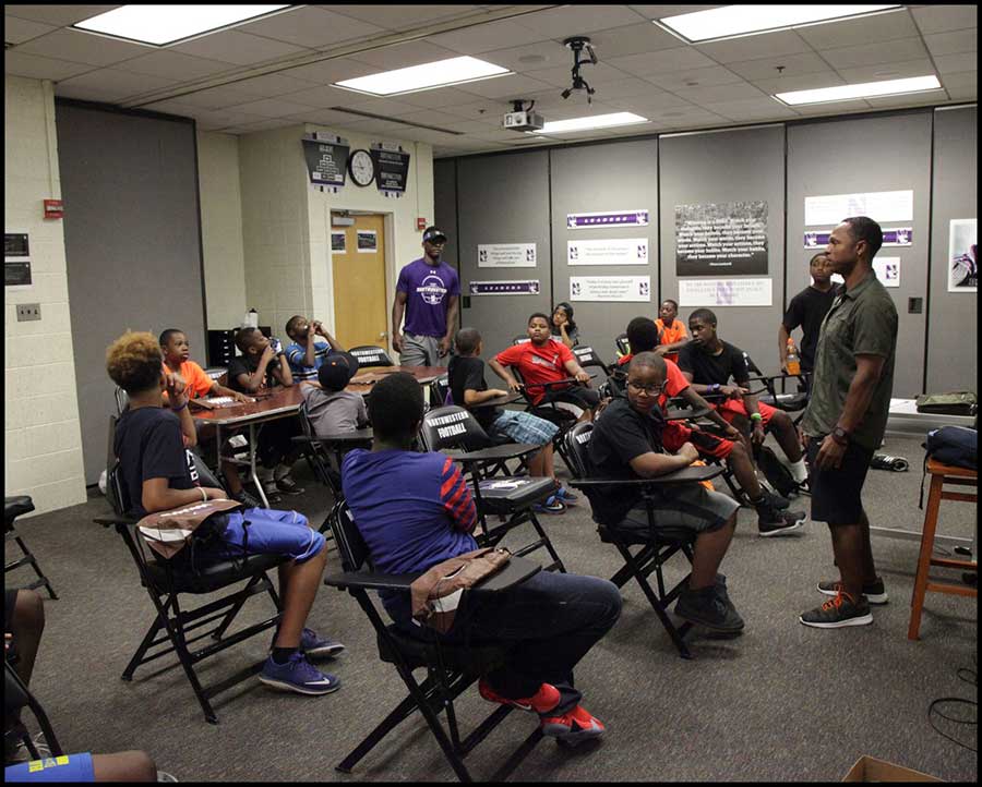 Students listening to coach