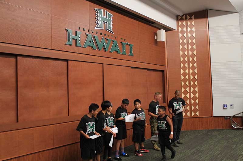 Boys in black jersey standing on the stage