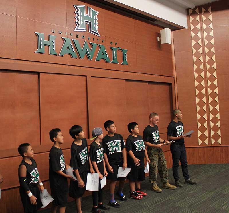 Boys in black jersey standing on the stage