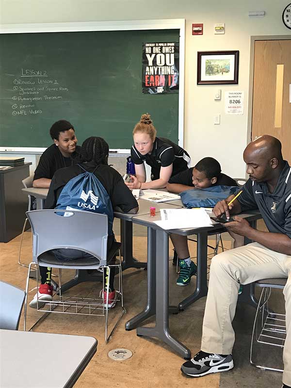 Students discussing on the study table