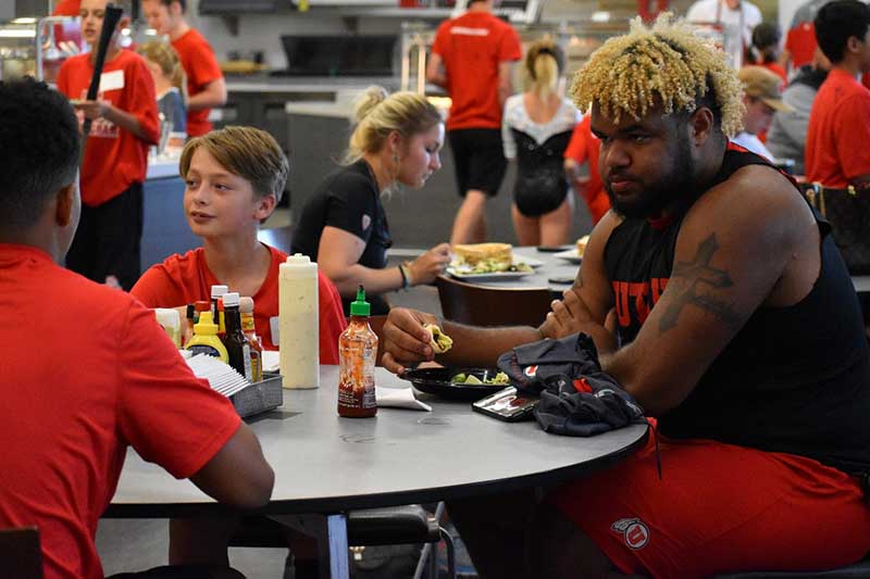 Parent having food with students