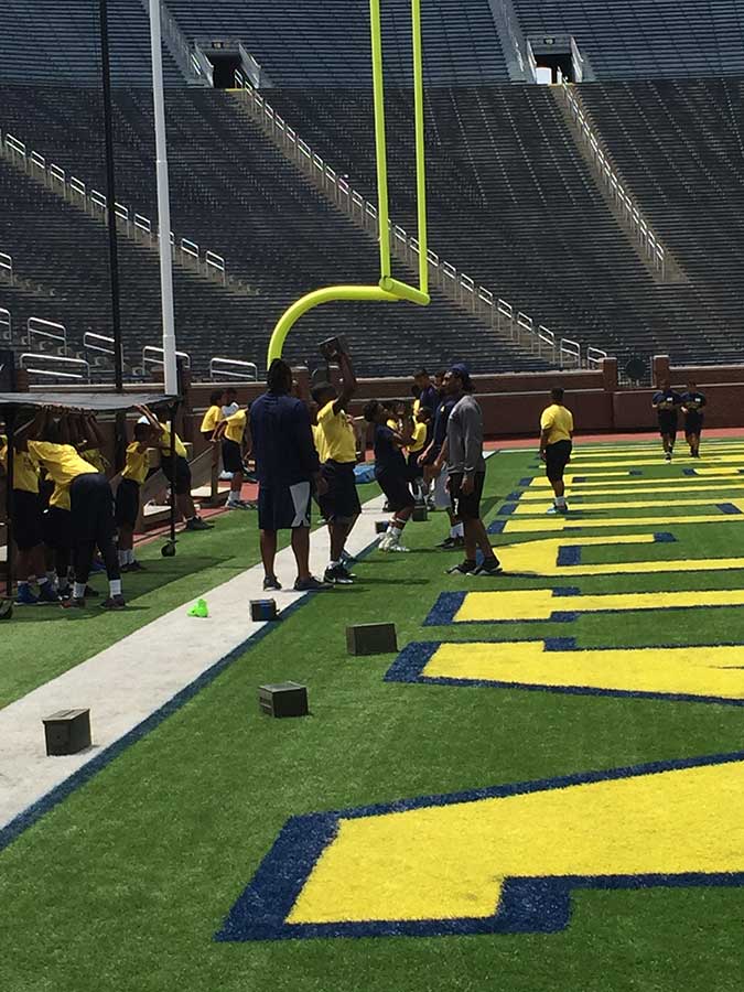 Boys playing on the stadium ground