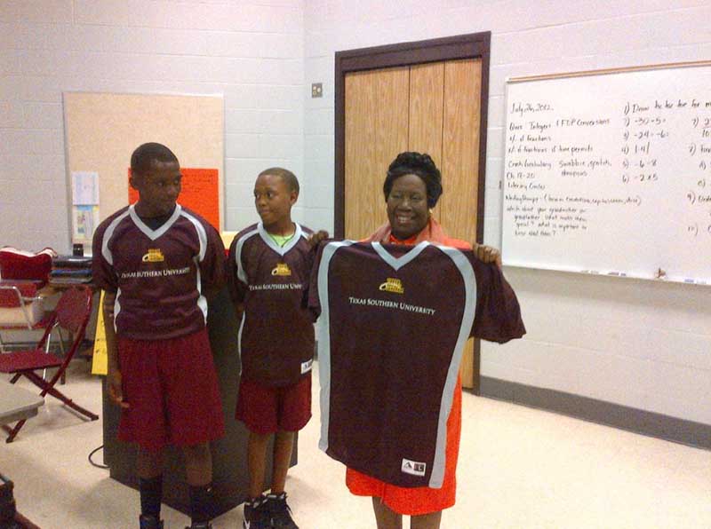 Boys holding jersey in hand